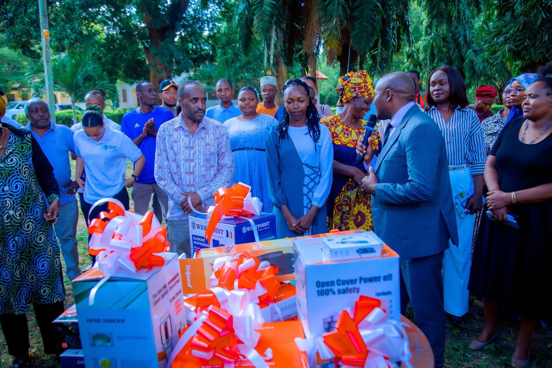 Entrepreneurs and programme partners at an IMED technical-assistance handover in Tanga