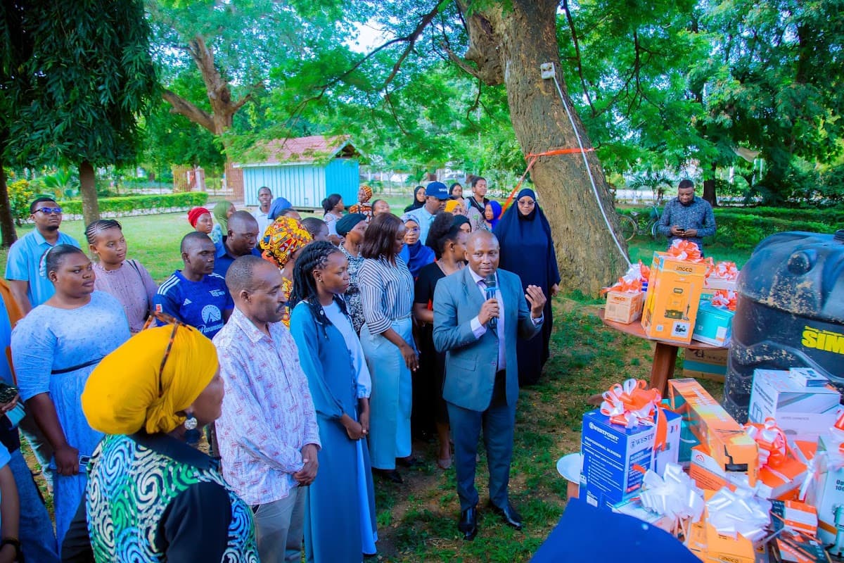 Participants and delivery partners reviewing technical assistance equipment for supported enterprises